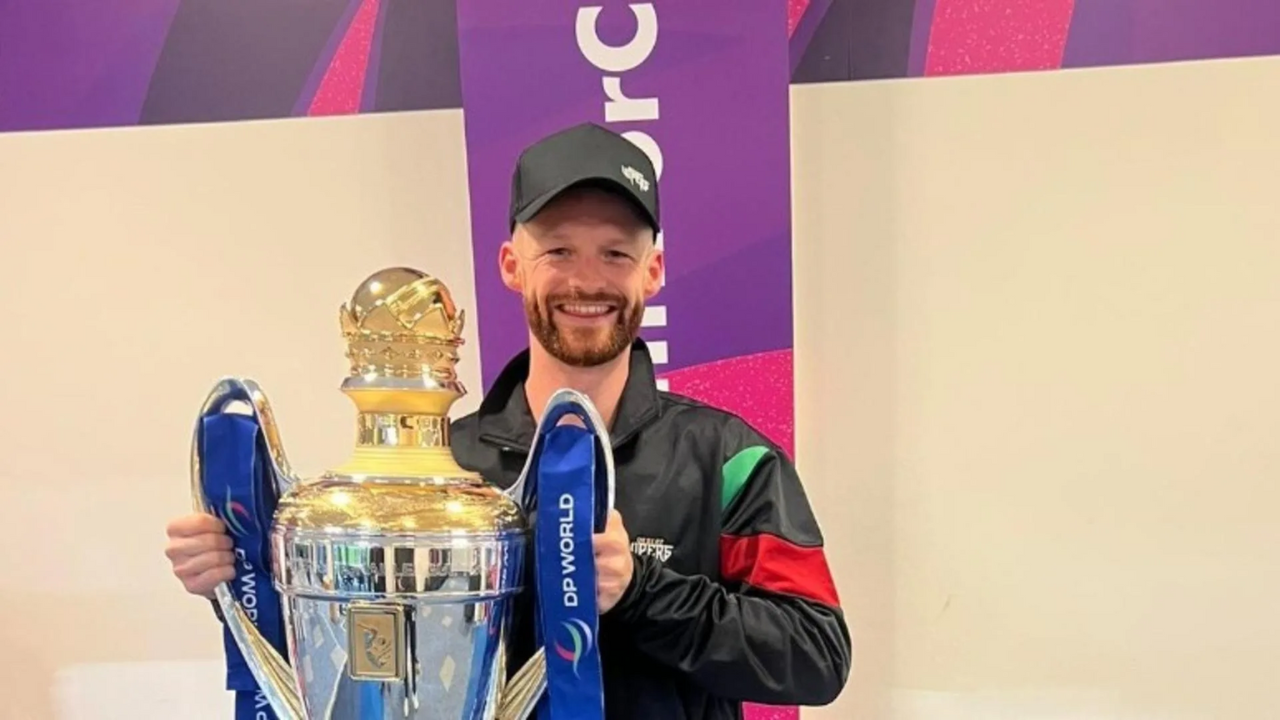 Desert Vipers ILT20 Head Analyst Freddie Wilde smiling while holding the DP World ILT20 trophy