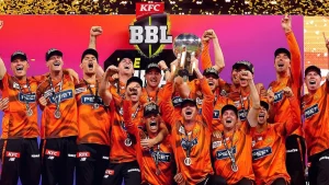 Perth Scorchers players celebrate their victory in BBL15, lifting the trophy and cheering on stage after winning the Big Bash League 2026.