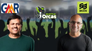 Soma Somasegar and Sanjay Parthasarathy with Seattle Orcas logo in center, GMR and Southern Brave logos in background at cricket stadium.