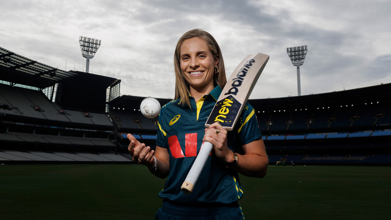 Sophie Molineux, captain of the Australian women's cricket team, holding a bat and cricket ball at a stadium
