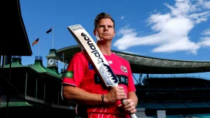 Steve Smith in Sydney Sixers jersey holding a cricket bat at the SCG ahead of BBL 2025