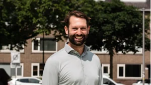 David Woutersen smiling outdoors in a professional profile photo related to cricket administration.