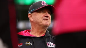 Greg Shipperd, head coach of the Sydney Sixers, wearing team gear during a Big Bash League match