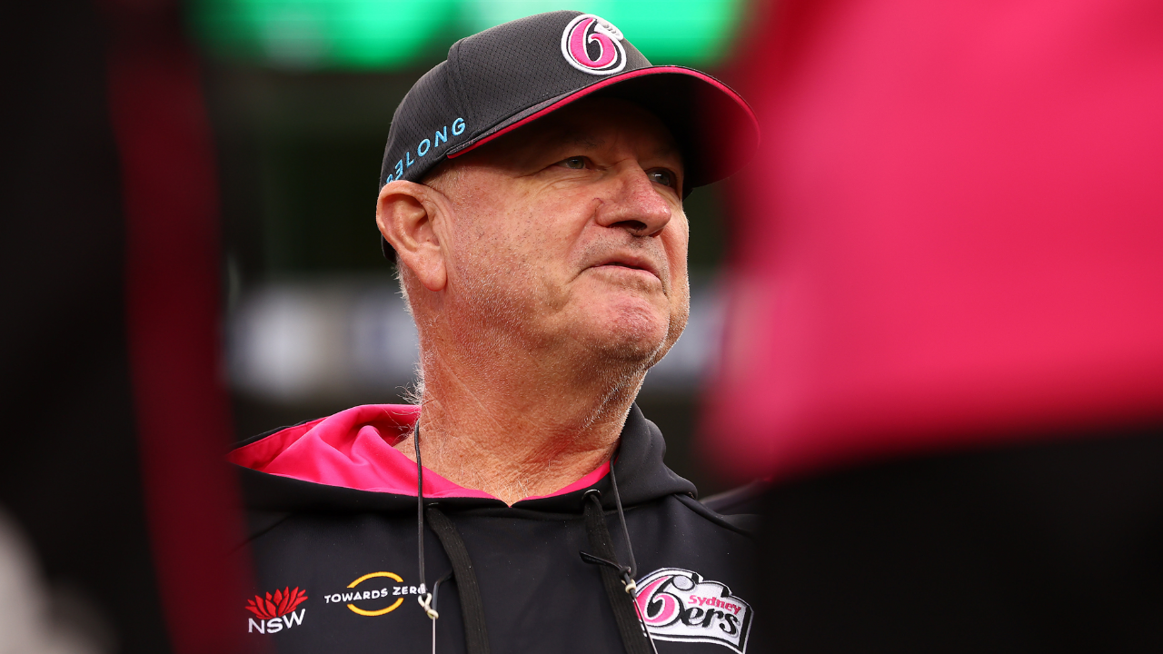 Greg Shipperd, head coach of the Sydney Sixers, wearing team gear during a Big Bash League match