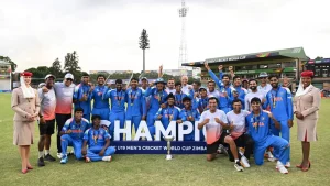 India U19 cricket team celebrates winning the ICC U19 Men's Cricket World Cup 2026 in Zimbabwe with players and coaches posing with the trophy
