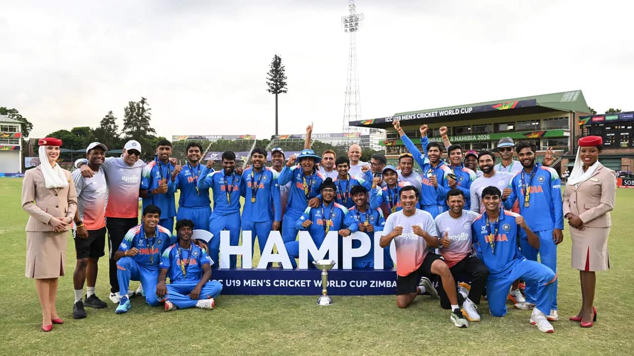 India U19 cricket team celebrates winning the ICC U19 Men's Cricket World Cup 2026 in Zimbabwe with players and coaches posing with the trophy