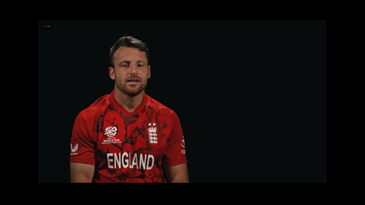 Jos Buttler wearing England T20 cricket jersey during an interview against a black background