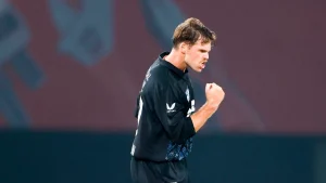 New Zealand fast bowler Lockie Ferguson celebrates with a fist pump during an international cricket match.