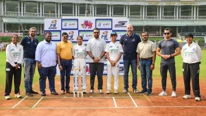 Mumbai Indians officials and young cricketers at the launch of MI Junior, the Mumbai Indians inter-school cricket tournament, at a cricket ground.