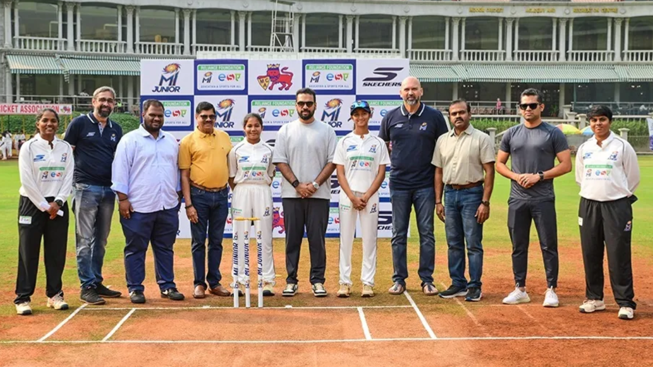 Mumbai Indians officials and young cricketers at the launch of MI Junior, the Mumbai Indians inter-school cricket tournament, at a cricket ground.
