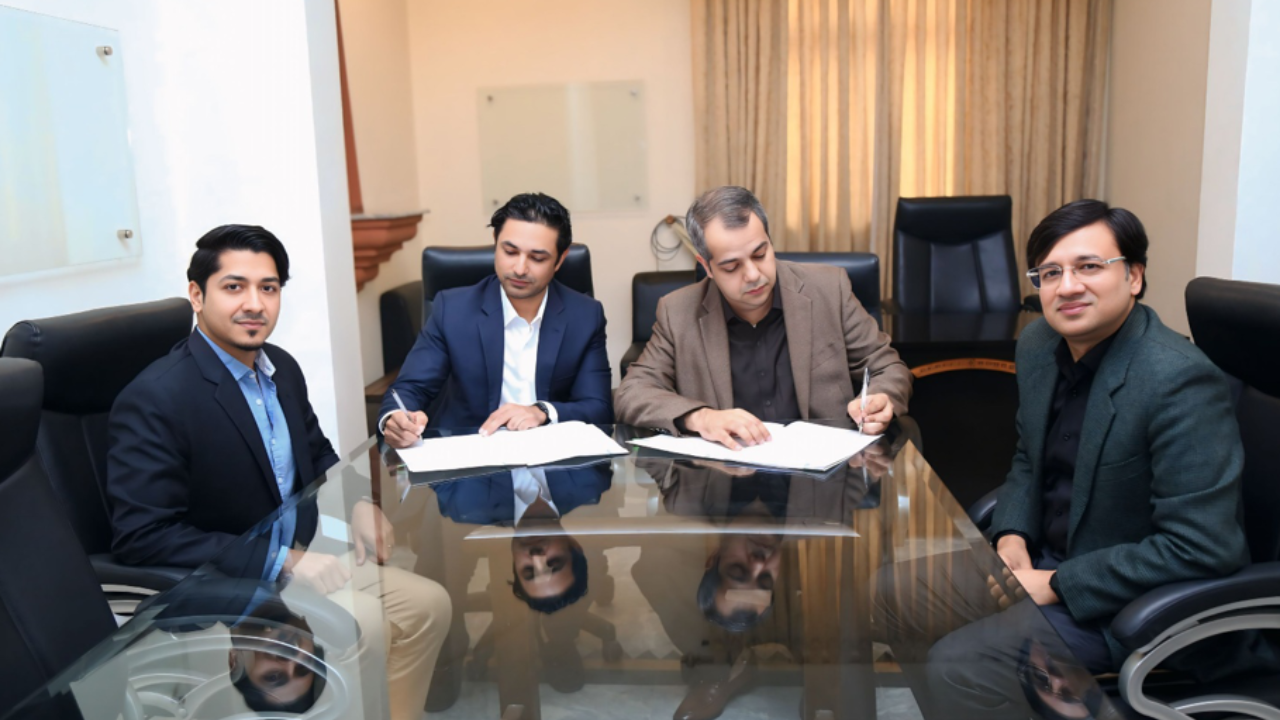 Sumair Ahmad Syed and Dr. Ali Adnan Zaidi of PCB with Aly Rana and Ali Altaf of tapmad during a partnership signing meeting.