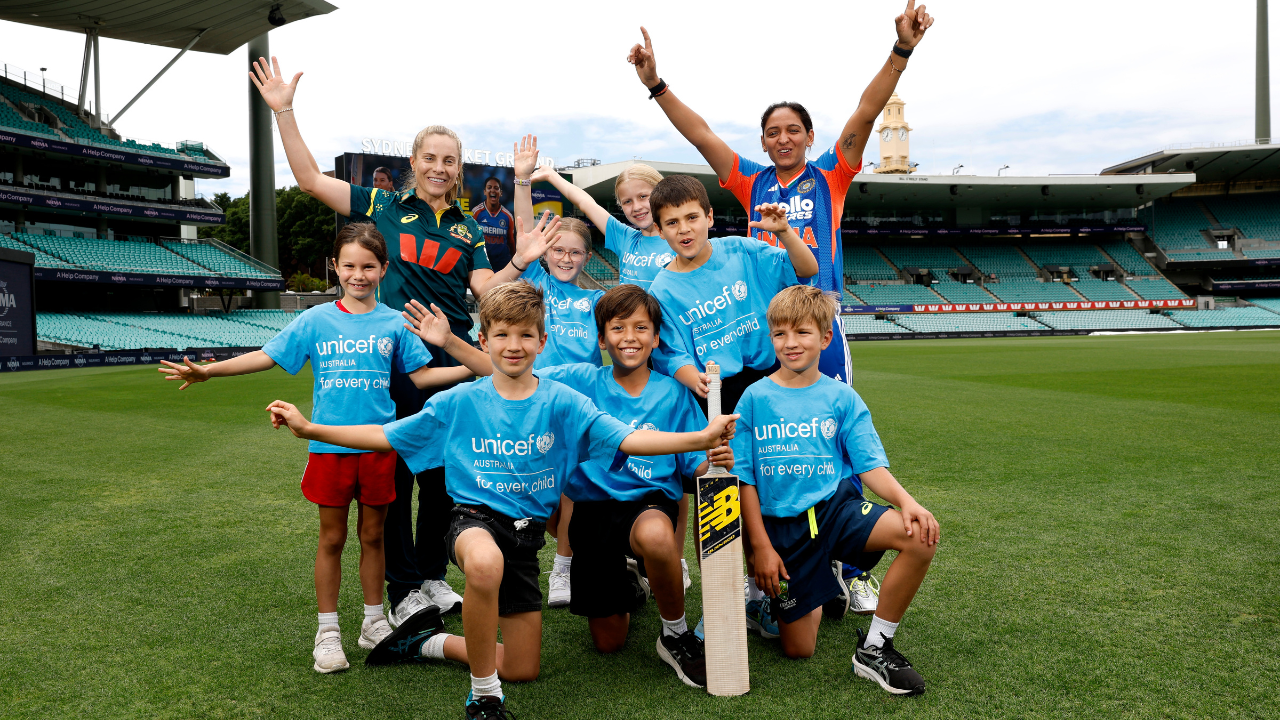 Sophie Molineux and Harmanpreet Kaur join children at the Sydney Cricket Ground to launch the UNICEF Australia cricket campaign.
