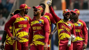 West Indies cricket team players in red and yellow kits during an ICC T20 World Cup 2026 match.