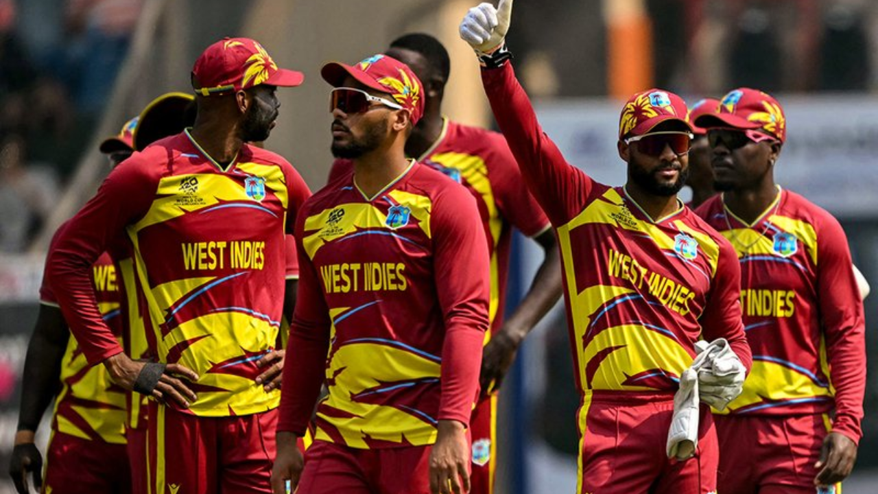 West Indies cricket team players in red and yellow kits during an ICC T20 World Cup 2026 match.