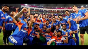 India national cricket team players celebrating together after winning the ICC Men’s T20 World Cup, posing for a group photo in the stadium wearing champion jerseys.