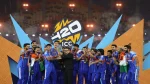India cricket team celebrating on stage as Jay Shah presents the ICC Men’s T20 World Cup trophy after their championship victory.