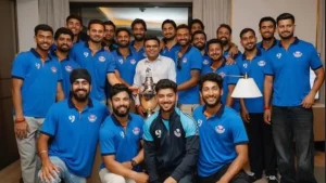 Former BCCI secretary Jay Shah meeting members of the Jammu and Kashmir cricket team during a team gathering with players posing together.