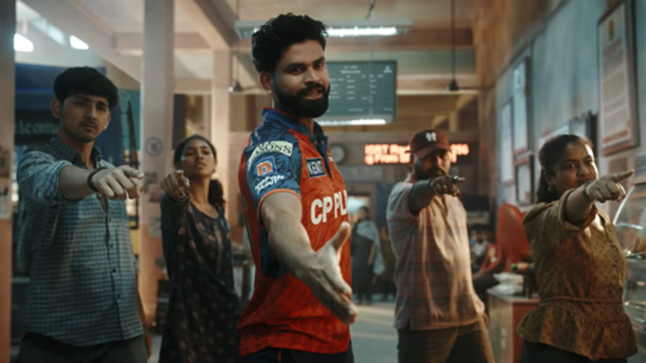 JioStar IPL 2026 Ek Hoke Dekh campaign featuring cricket player in team jersey reaching out with fans pointing forward inside indoor setting