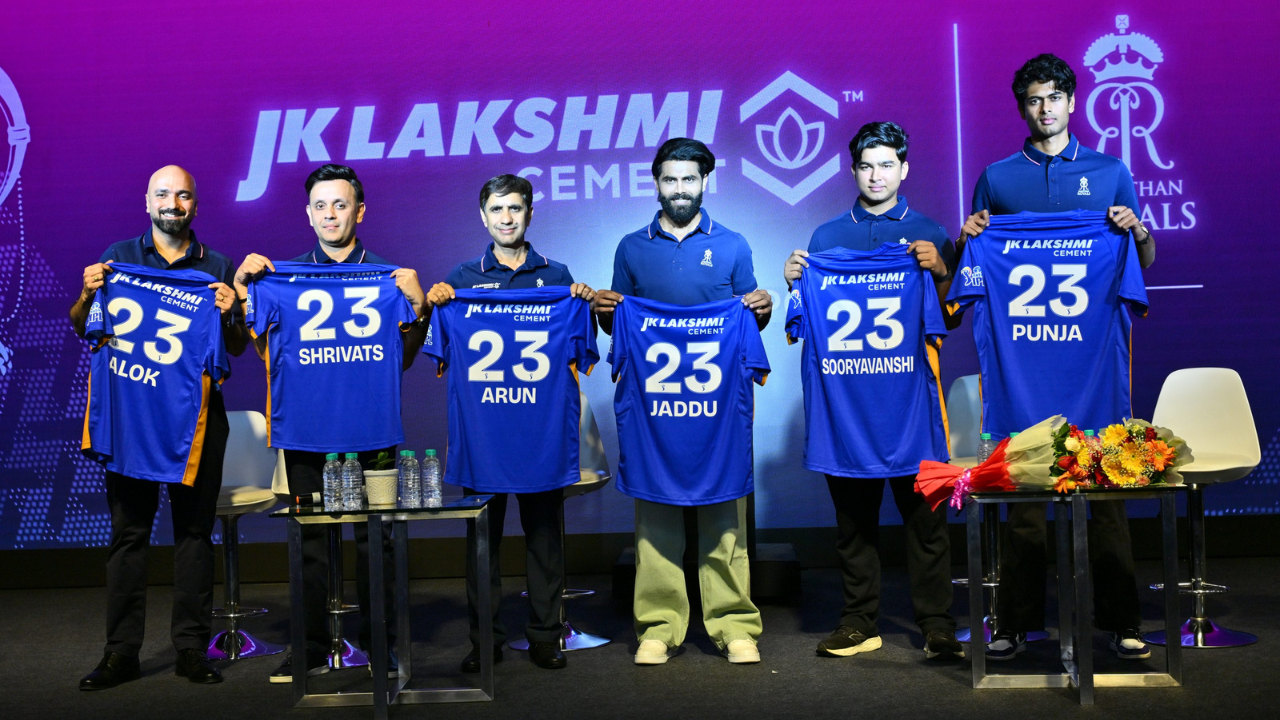 JK Lakshmi Cement Rajasthan Royals IPL team jersey launch event with players and management holding shirts
