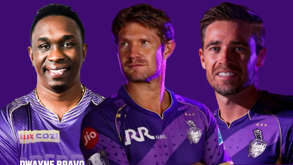 KKR coaches Dwayne Bravo, Shane Watson, and Tim Southee in Kolkata Knight Riders jerseys.