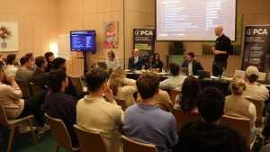 PCA Players’ Committee panel addressing members during the Professional Cricketers’ Association Annual General Meeting (AGM) with attendees seated in the conference room.
