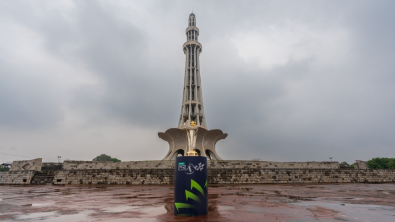 PSL 11 trophy displayed in front of Minar-e-Pakistan in Lahore under cloudy sky with historic monument in background