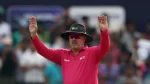 ICC umpire Richard Illingworth signals during an international cricket match while wearing official ICC umpire uniform.
