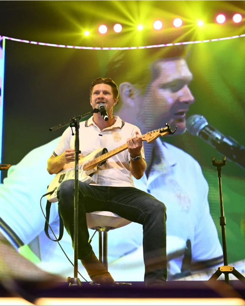Shane Watson performing live with guitar at Kolkata Knight Riders Knights Unplugged 3.0 event on stage