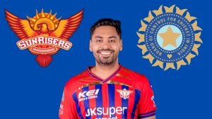 Avesh Khan in Sunrisers Hyderabad jersey with SRH and BCCI logos on blue background