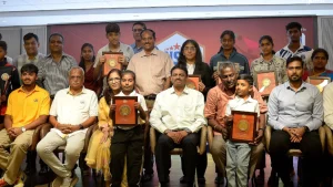 Award winners and officials pose with plaques at the Chennai Super Kings and Tamil Nadu Sports Journalists’ Association Awards and Scholarships 2026 ceremony.