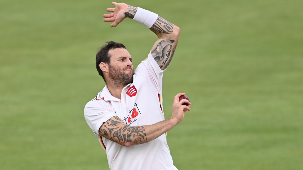 Doug Bracewell bowling during a cricket match, captured mid-action with arm extended delivering the ball