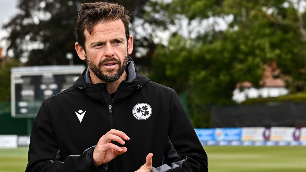 Ed Joyce during Ireland cricket training session discussing tactics on the field as team coach