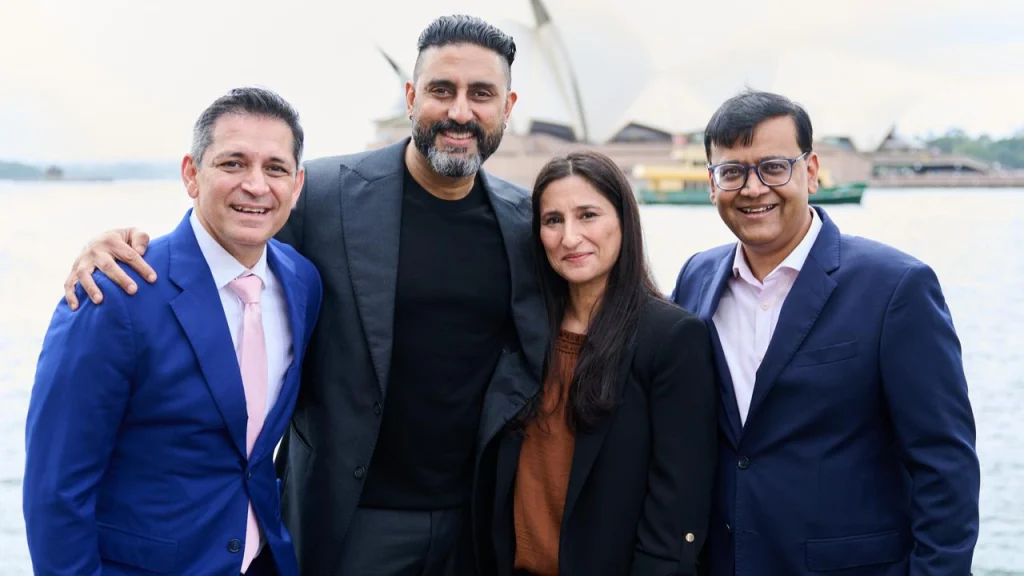 ETPL co-founders Dhiraj Malhotra, Abhishek Bachchan, Priyanka Kaul and Saurav Banerjee posing together in Sydney with Opera House in background