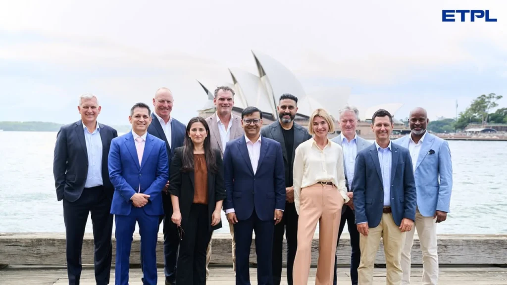 ETPL league officials including Steve Waugh, Abhishek Bachchan, and Kyle Mills pose for a group photo in front of the Sydney Opera House in 2026.