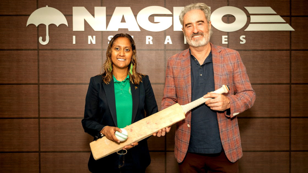 Kyria Ali CEO of NAGICO Insurances and Global Super League Director Jamie Stewart holding cricket bat during partnership event announcement
