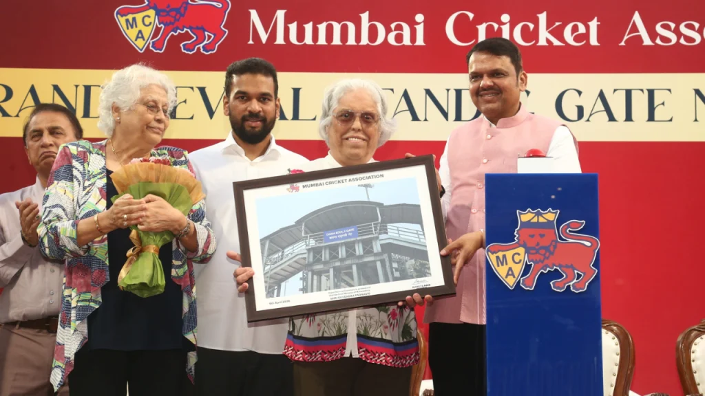 Mumbai Cricket Association ceremony featuring Devendra Fadnavis, Sunil Gavaskar, Diana Edulji, Ravi Shastri, Ashish Shelar and Ajinkya Naik at an official stage event.