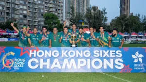 Pakistan cricket team celebrating Hong Kong Sixes 2025 title with trophy and champions banner