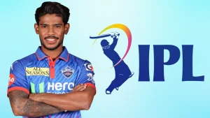Pathum Nissanka in Delhi Capitals jersey with IPL logo graphic, posing with arms crossed against a light background.