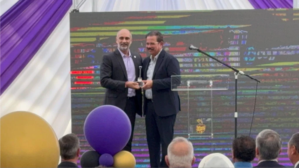 ICC CEO Sanjog Gupta and Venky Mysore exchanging memento at Knight Riders cricket groundbreaking event.