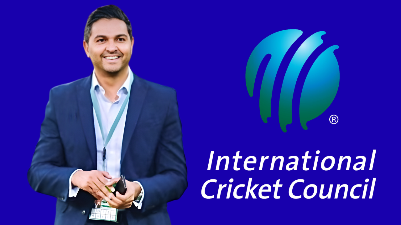 Wasim Khan standing in front of International Cricket Council ICC logo on blue background.