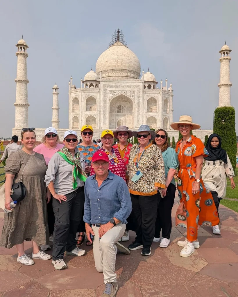 ATW Troopers tour participants posing in front of the Taj Mahal during the 2025 Women’s Premier League (WPL) cricket travel experience in India.