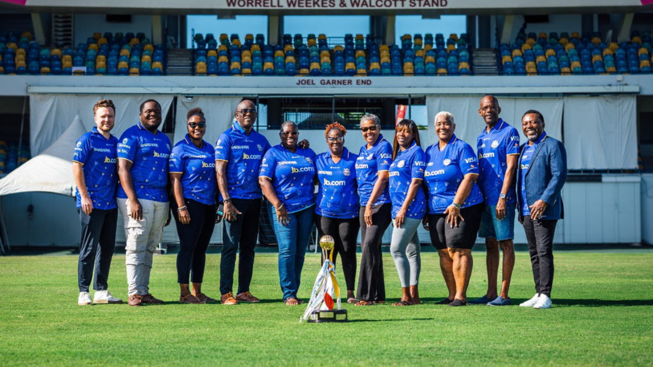 Barbados Tridents CPL franchise representatives posing with trophy at Kensington Oval cricket stadium in Barbados.