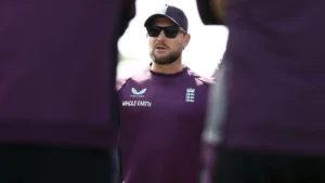 England men's cricket head coach Brendon McCullum addresses players during a training session ahead of an international match.