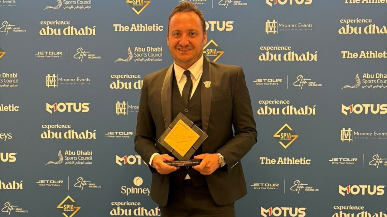 Desert Vipers Development Lead Jack Luffman holding the Excellence in Sustainability award at the Sports Industry Awards 2026 in Abu Dhabi for the Season 4 Desert Vipers Sustainability Match.