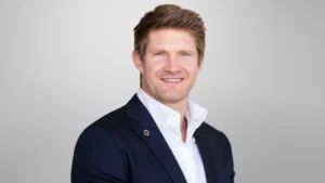 Portrait of Shane Watson, former Australia all-rounder and cricket commentator, in formal attire.