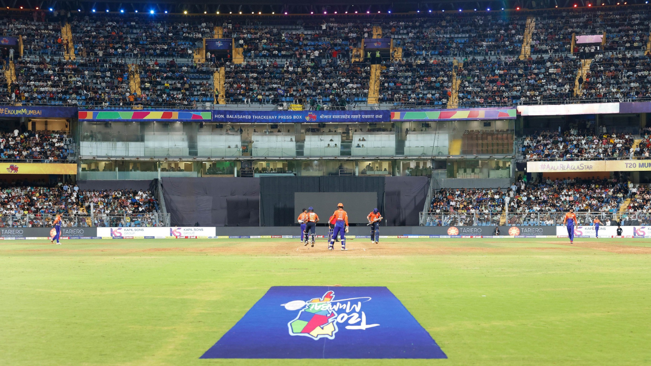 Wide view of a T20 Mumbai League 2026 cricket match at Wankhede Stadium with players on the field and a packed crowd in attendance.
