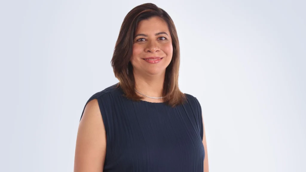 Portrait of Toranj Mehta, De Beers’ India Country Head for Natural Diamond Marketing, smiling in a professional studio photograph.