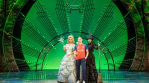 Performers from Wicked pose with an England women’s cricketer on stage ahead of the ICC Women’s T20 World Cup opening performance at Edgbaston on 12 June.