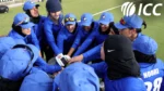 Afghanistan women's cricket team players gather in a team huddle during an ICC training session on the cricket field.