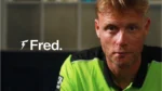 Andrew Flintoff, head coach of Sydney Thunder, during a promotional appearance in team apparel ahead of a cricket season.